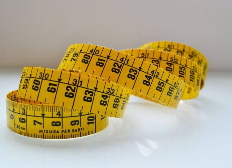 yellow tape measure all coiled up