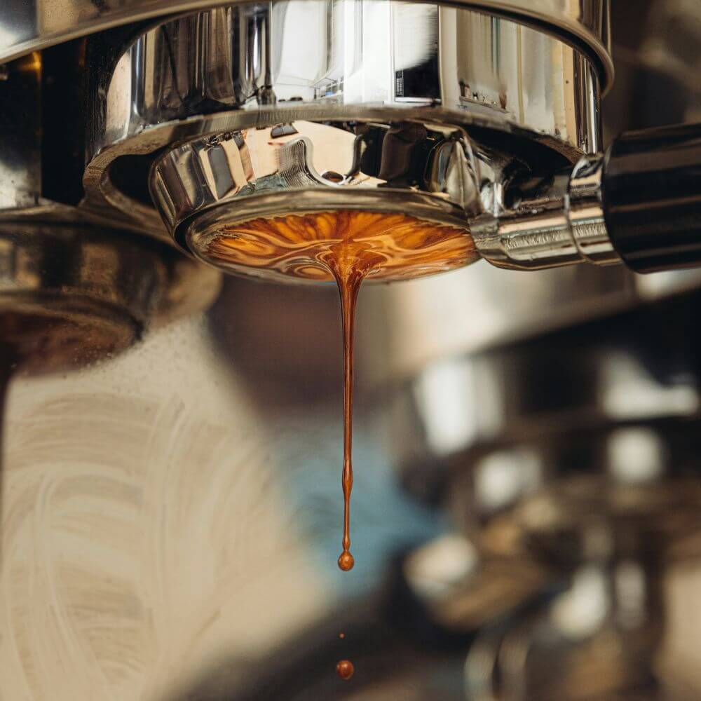 close up of espresso dripping out